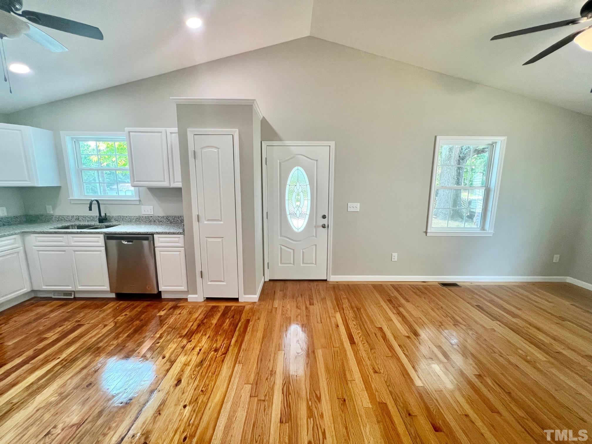 830 South Main Street Roxboro, NC 27573 - Photo 3 of 20 a view of a kitchen with wooden floor and window