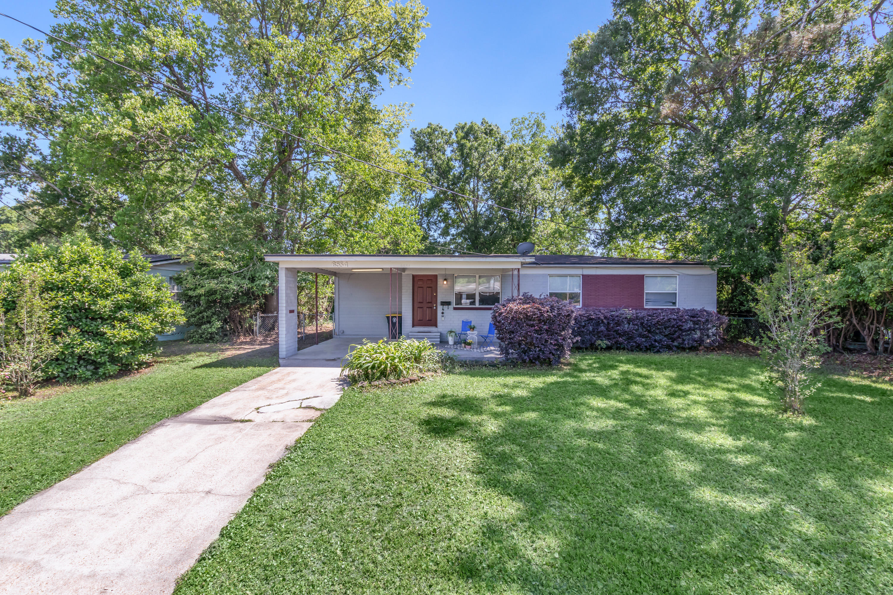 6554 Aires Road Jacksonville, FL 32244 - Photo 1 of 29 a view of a house with a yard and a garden