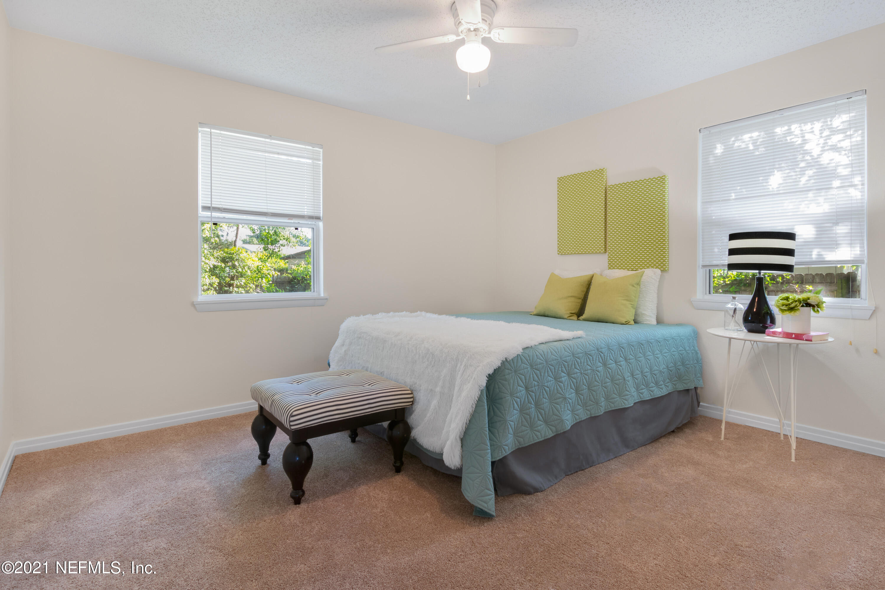 6554 Aires Road Jacksonville, FL 32244 - Photo 14 of 29 a bedroom with a bed and a window