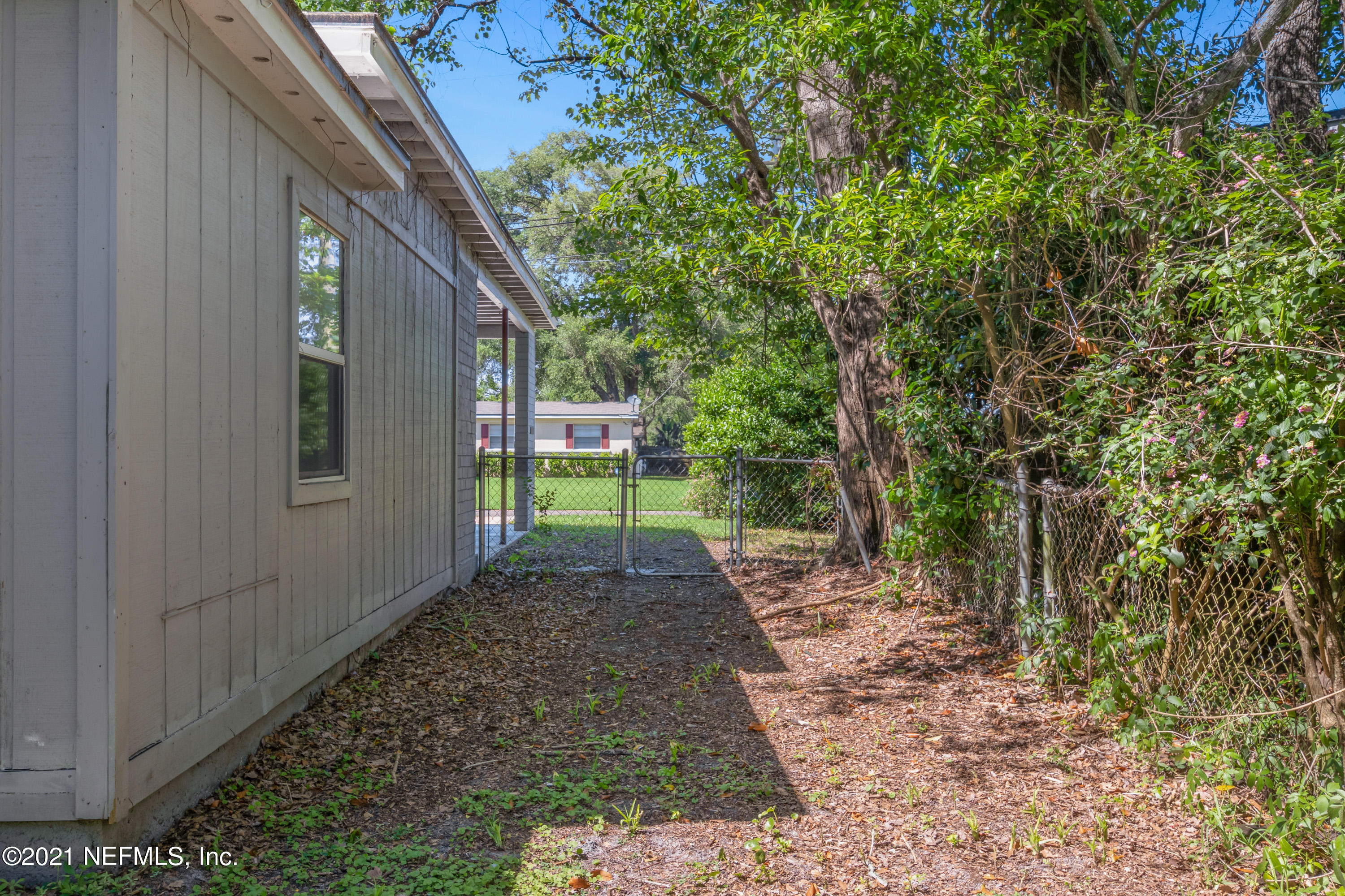 6554 Aires Road Jacksonville, FL 32244 - Photo 25 of 29 a backyard of a house with outdoor seating
