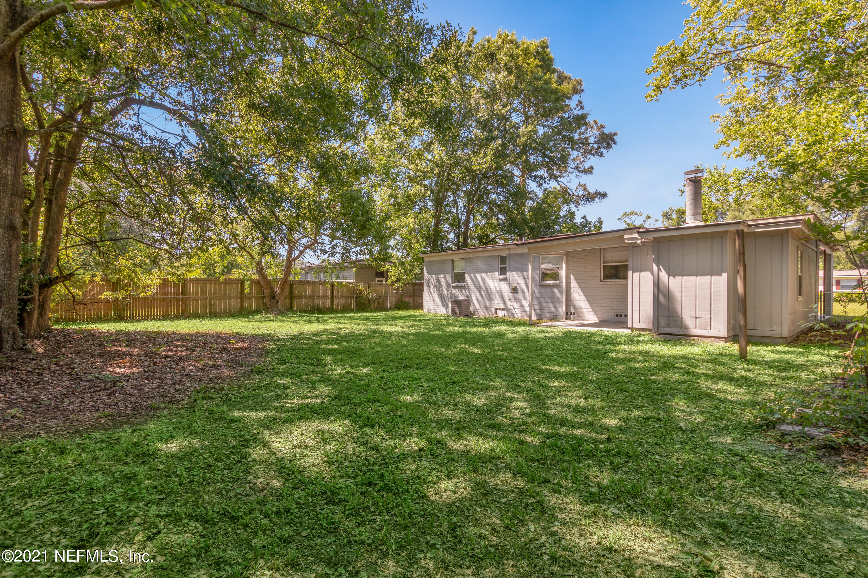 6554 Aires Road Jacksonville, FL 32244 - Photo 26 of 29 a view of a house with a yard