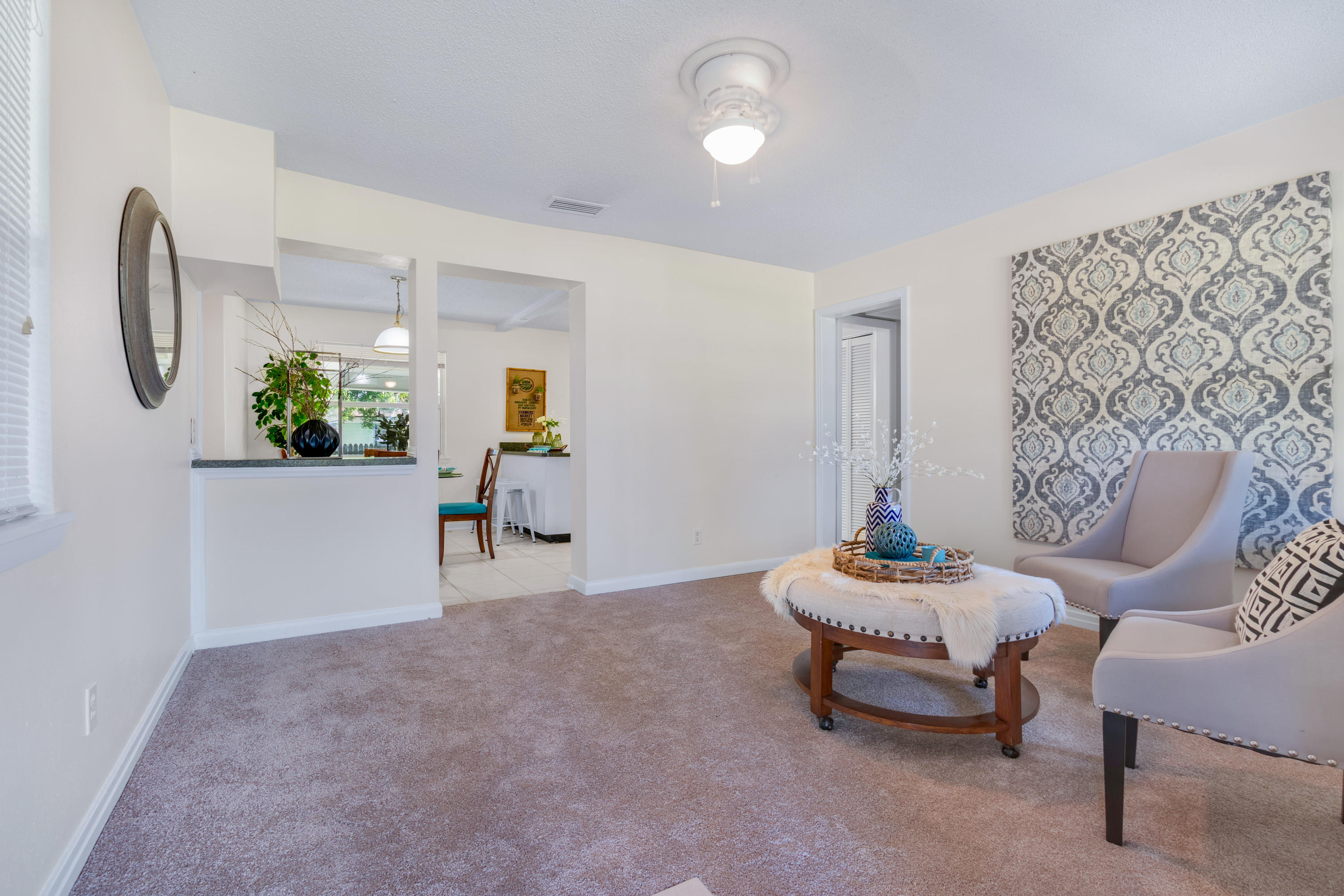 6554 Aires Road Jacksonville, FL 32244 - Photo 7 of 29 a living room with furniture and a potted plant