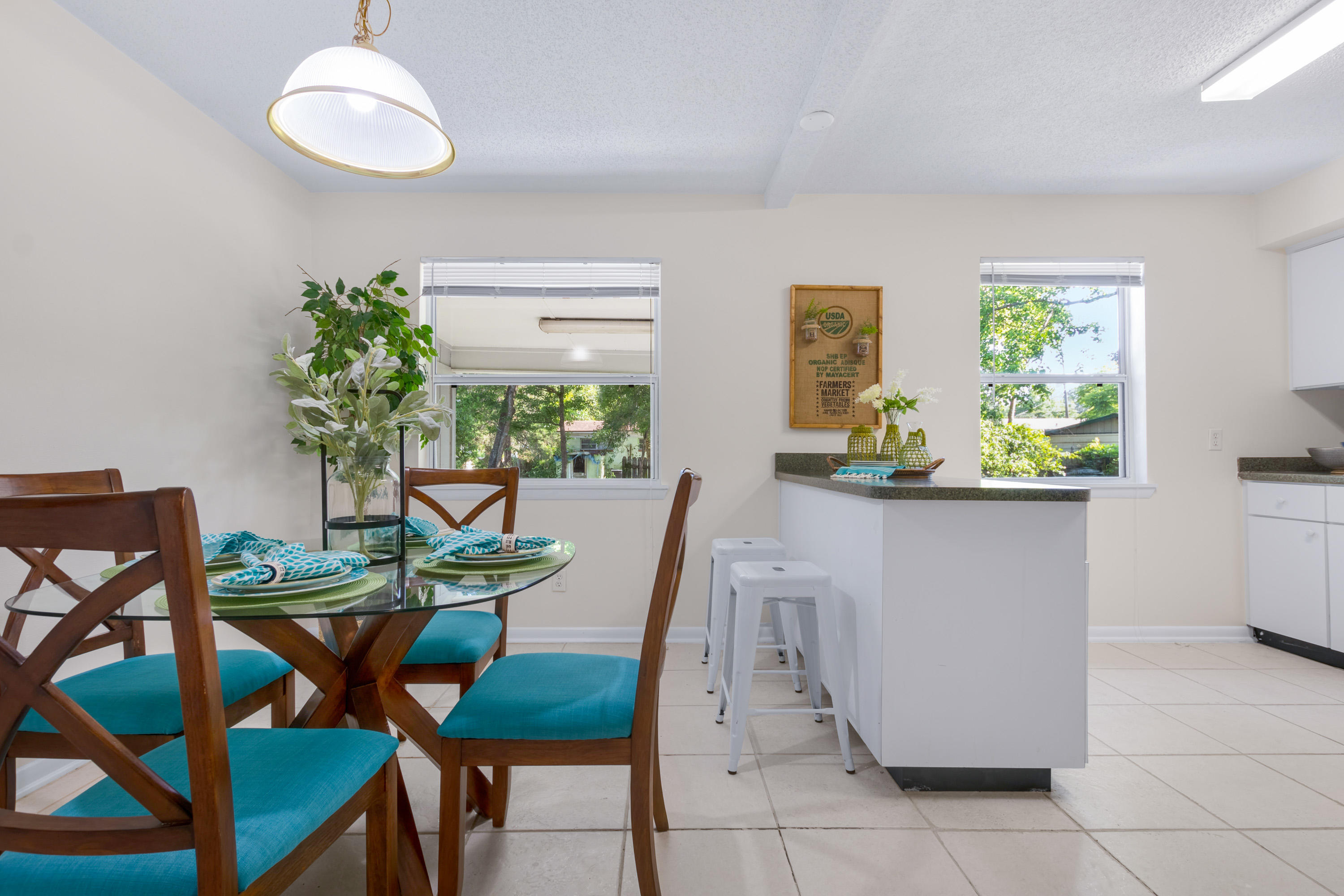 6554 Aires Road Jacksonville, FL 32244 - Photo 8 of 29 a view of a dining room with furniture and a potted plant