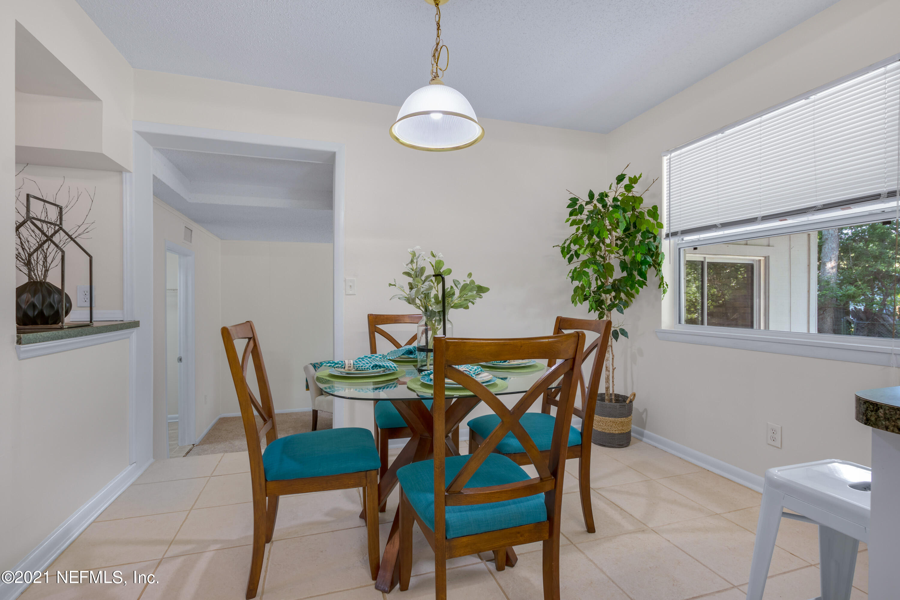 6554 Aires Road Jacksonville, FL 32244 - Photo 9 of 29 a dining room with furniture and window