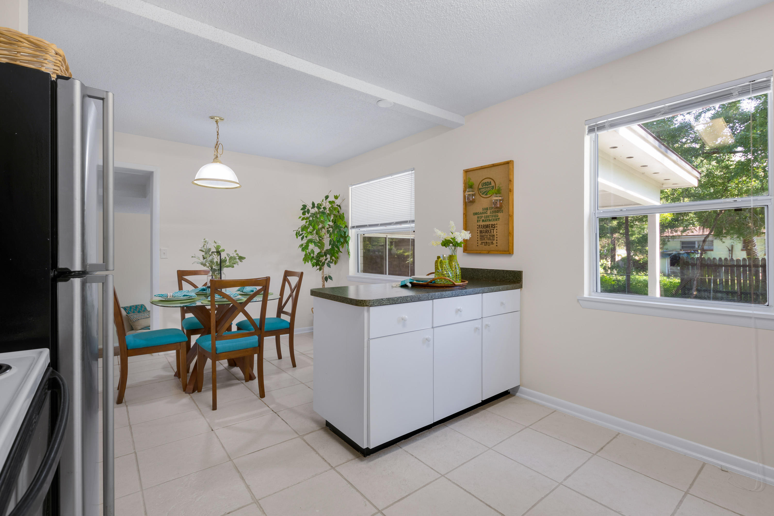 6554 Aires Road Jacksonville, FL 32244 - Photo 10 of 29 a kitchen with granite countertop white cabinets and stainless steel appliances