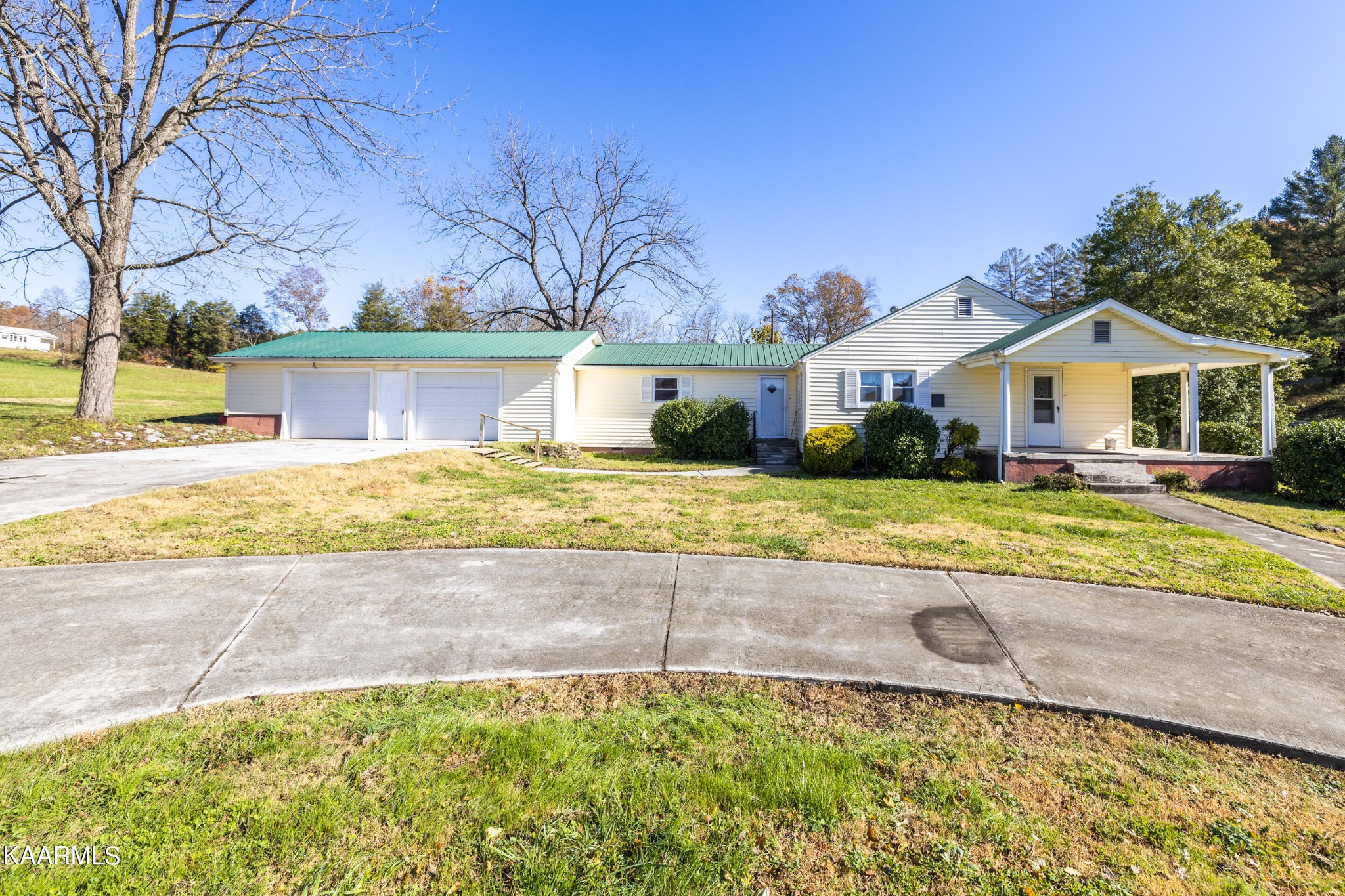 372 Raccoon Valley Road, Unit 1 Maynardville, TN 37807 - Photo 37 of 42 a front view of a house with a yard and garage