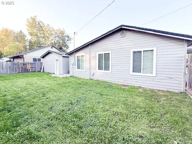 a view of a backyard of the house