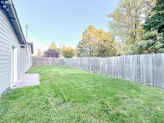 a backyard of a house with lots of green space
