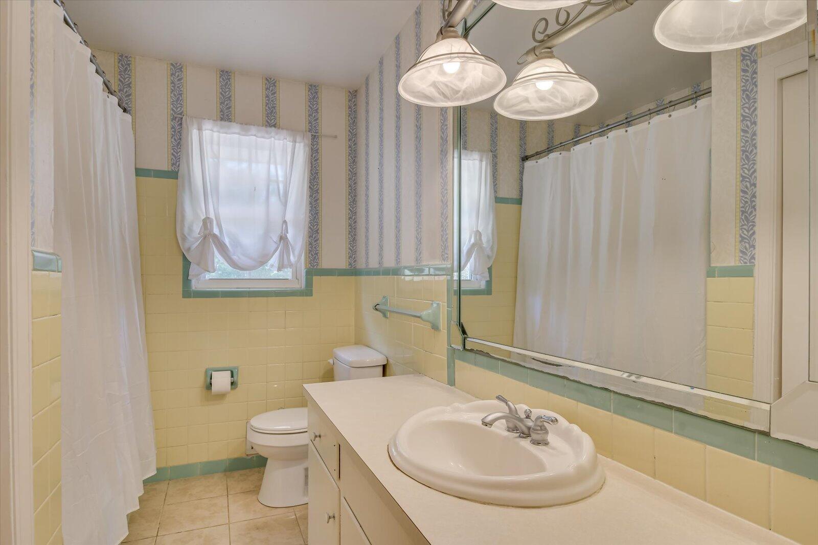 308 5th Street Jackson, SC 29831 - Photo 34 of 70 a bathroom with a sink a toilet and a mirror