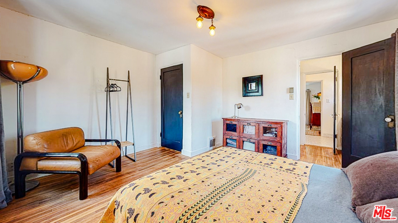 6854 Iris Circle Los Angeles, CA 90068 - Photo 17 of 35 a bedroom with bed and chair