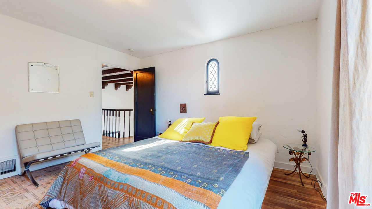 6854 Iris Circle Los Angeles, CA 90068 - Photo 19 of 35 a bedroom with a bed and a couch