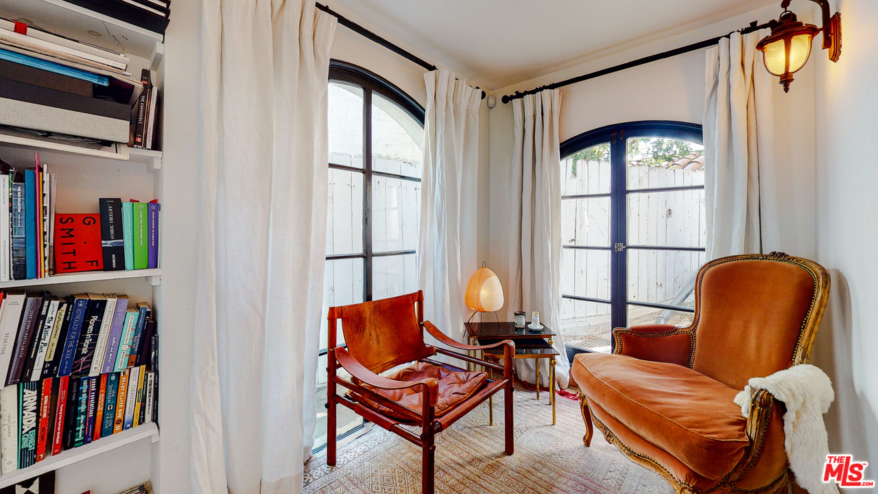 6854 Iris Circle Los Angeles, CA 90068 - Photo 28 of 35 a living room with furniture and a book shelf