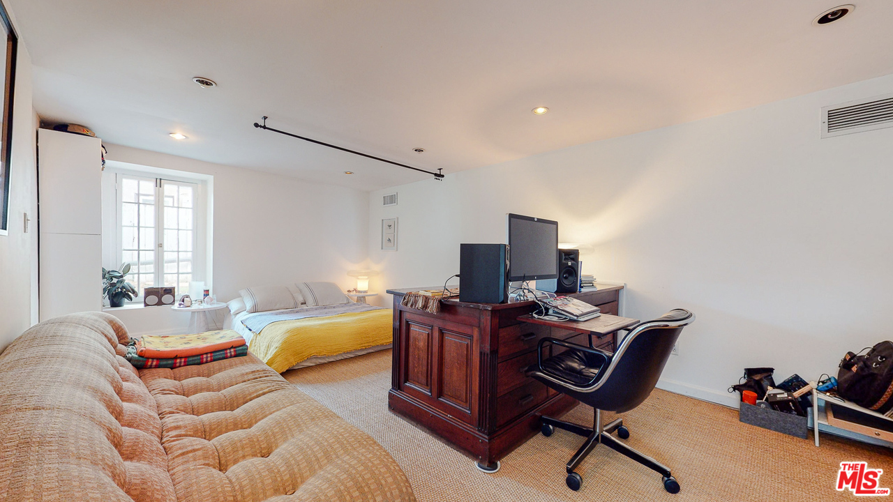 6854 Iris Circle Los Angeles, CA 90068 - Photo 29 of 35 a bedroom with furniture and a window