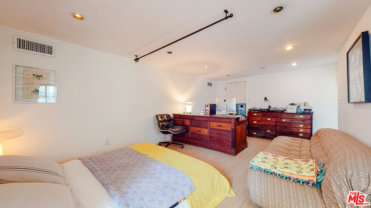 6854 Iris Circle Los Angeles, CA 90068 - Photo 30 of 35 a bed room with a bed and a couch