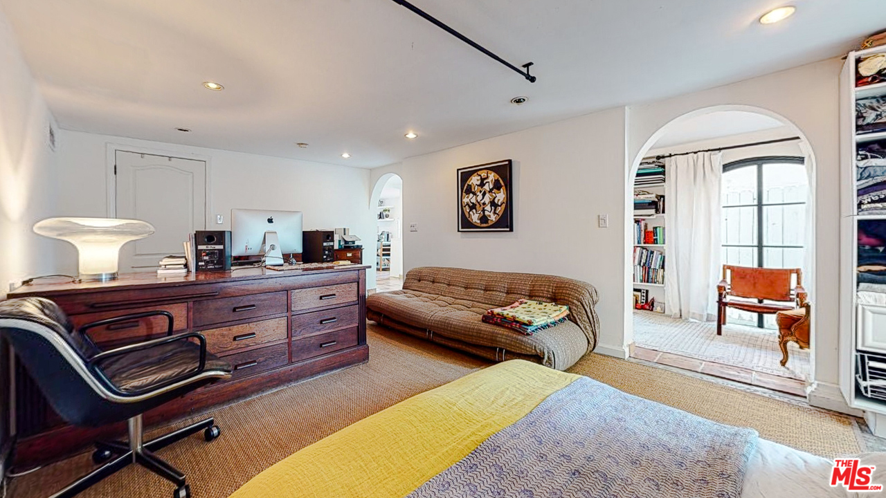 6854 Iris Circle Los Angeles, CA 90068 - Photo 31 of 35 a bedroom with a bed and wooden floor