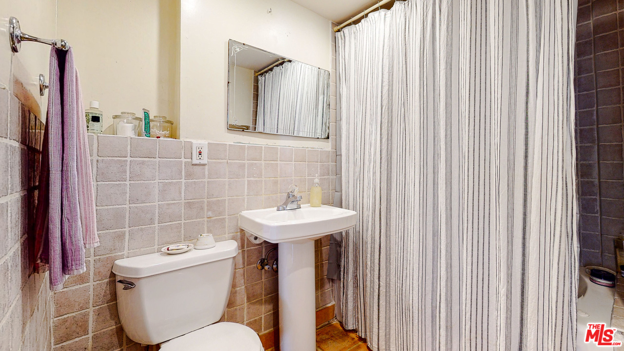 6854 Iris Circle Los Angeles, CA 90068 - Photo 32 of 35 a bathroom with a sink a toilet and shower