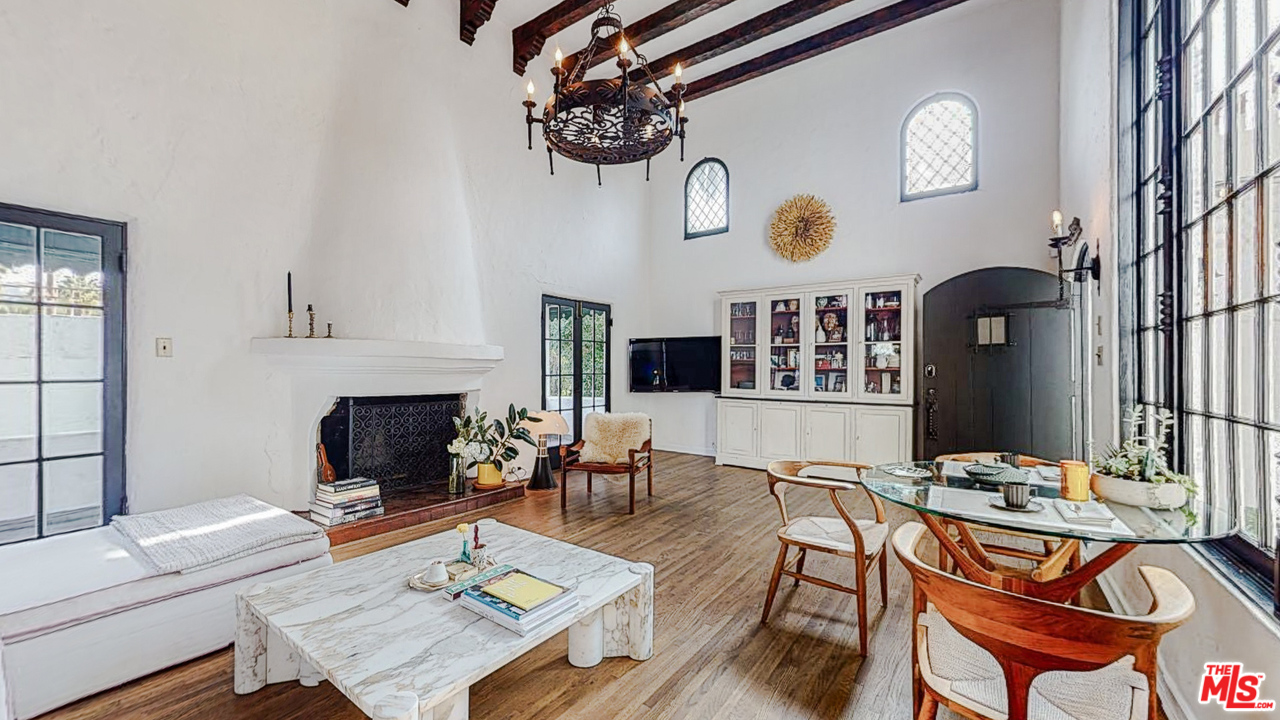 6854 Iris Circle Los Angeles, CA 90068 - Photo 5 of 35 a living room with furniture a fireplace and flat screen tv