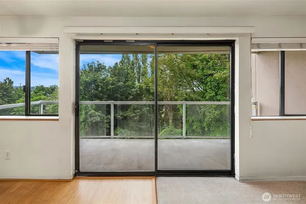 a view of a room that has a large window