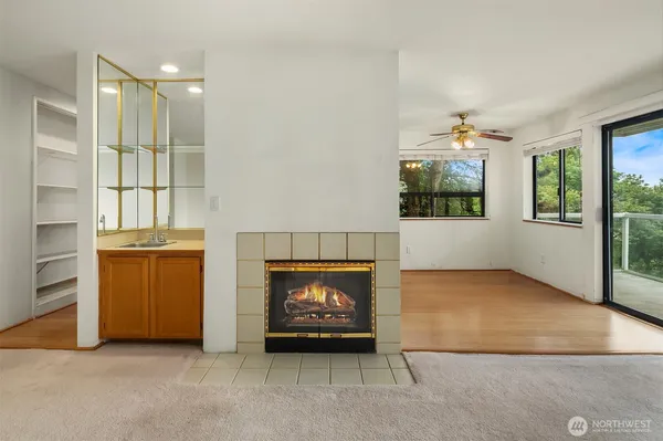a kitchen with stainless steel appliances a stove a sink and a microwave