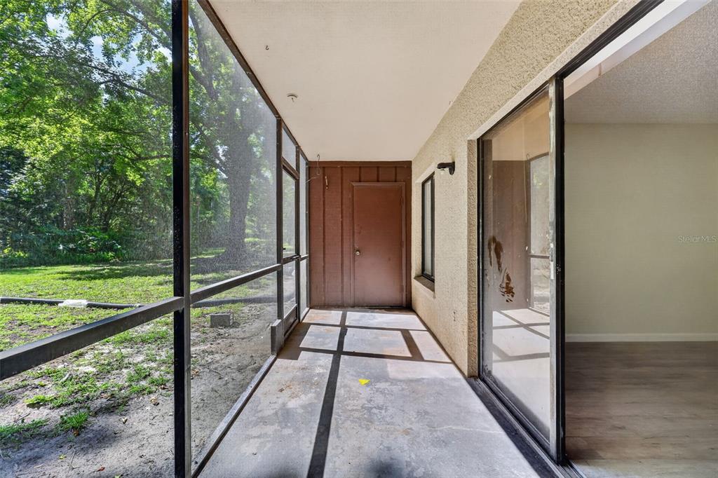 11715 Raintree Village Boulevard, Unit A Temple Terrace, FL 33617 - Photo 20 of 30 a view of a porch