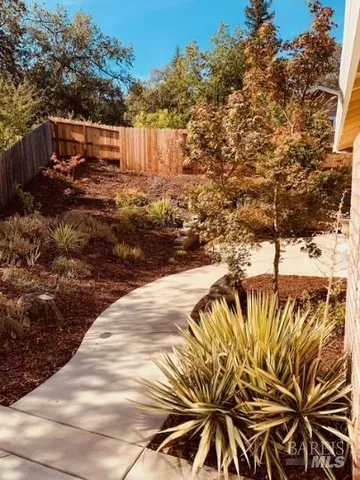 a view of a pathway with a yard