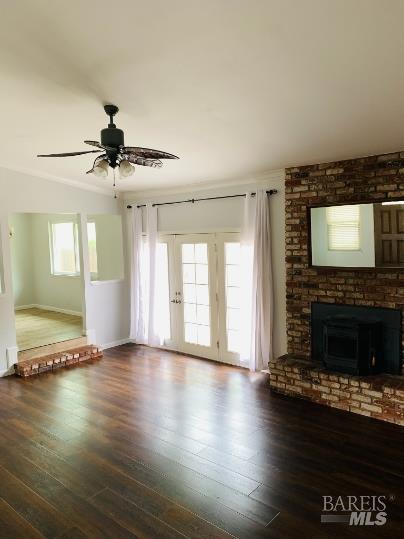 920 Linwood Street Vacaville, CA 95688 - Photo 17 of 38 a view of an empty room with wooden floor fireplace and a window