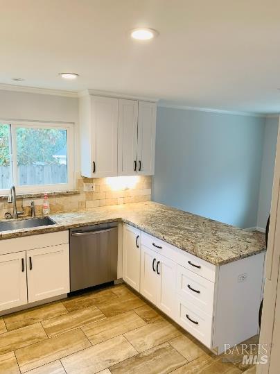 920 Linwood Street Vacaville, CA 95688 - Photo 25 of 38 a kitchen with granite countertop white cabinets and a sink