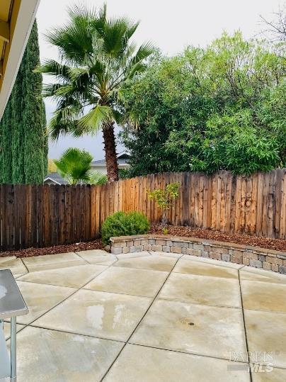 920 Linwood Street Vacaville, CA 95688 - Photo 33 of 38 a backyard of a house with plants and trees with wooden fence