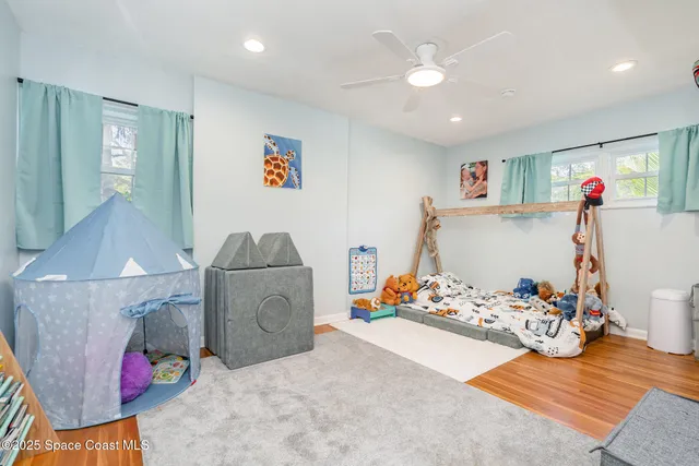 a bedroom with furniture and a chandelier