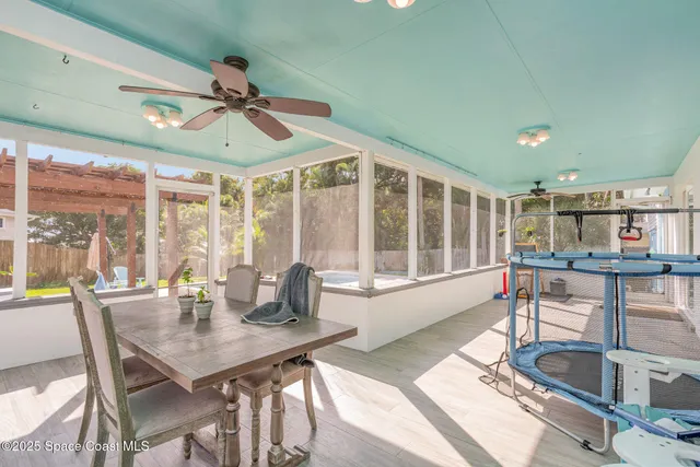 a view of a dining room with furniture window and outside view