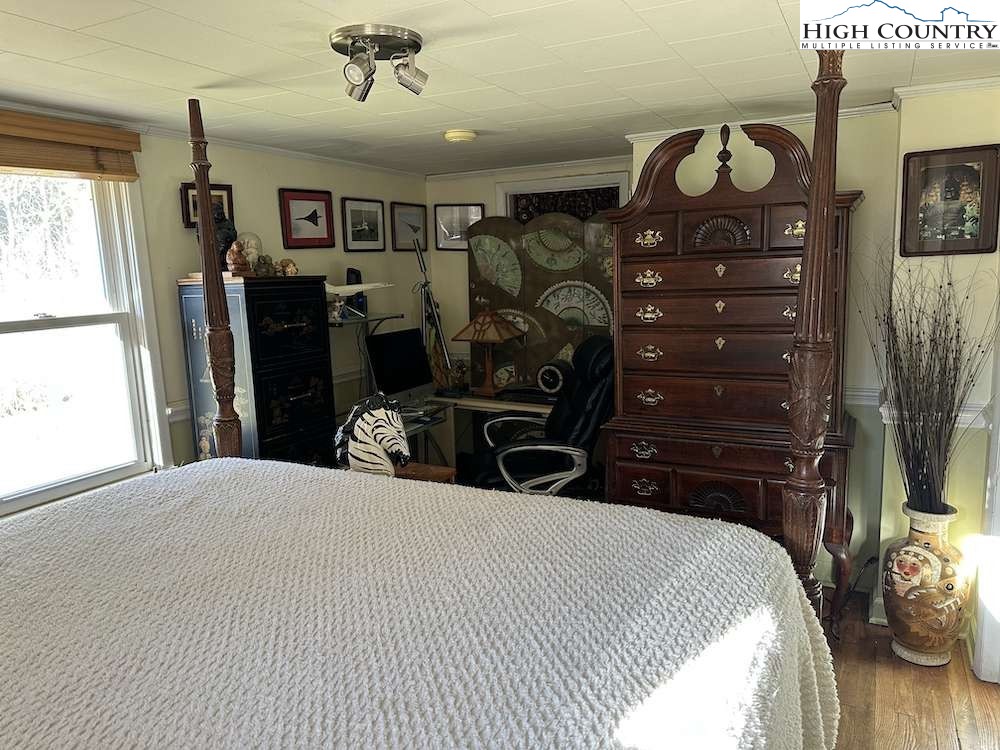 333 Mt Zion Road Deep Gap, NC 28618 - Photo 20 of 25 a bedroom with a bed and a tv in it