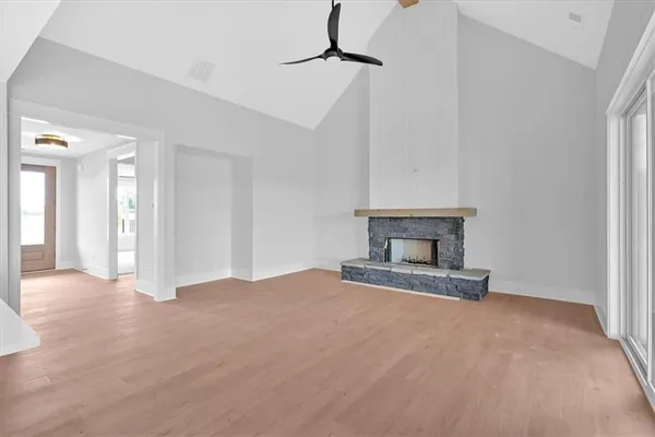 a view of an empty room with a fireplace