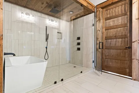 a bathroom with a shower and a tub