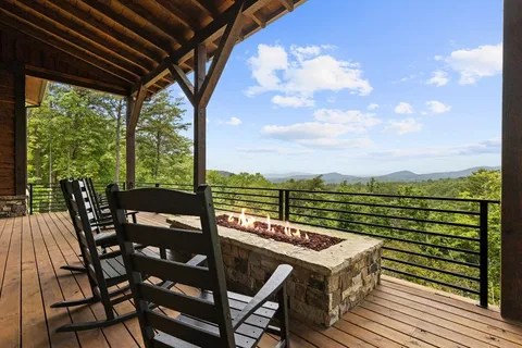 a view of a balcony with lake view and mountain view