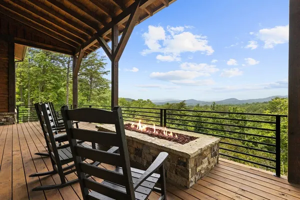 a view of a balcony with lake view and mountain view