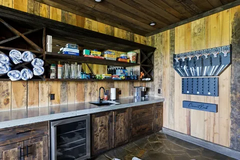 a kitchen with lots of wooden cabinets