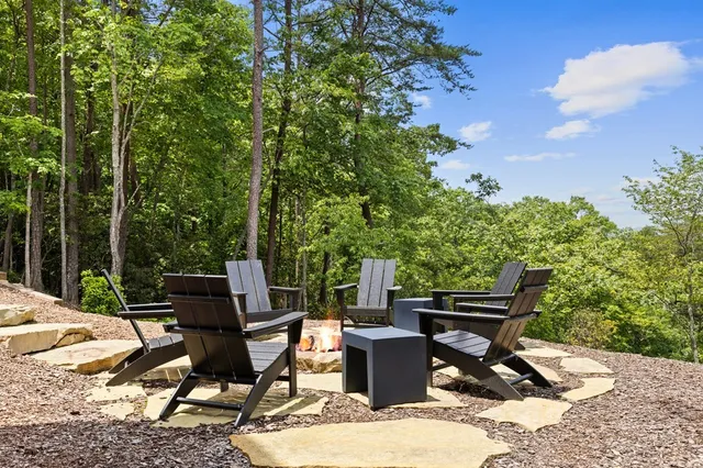 a view of a backyard with sitting area