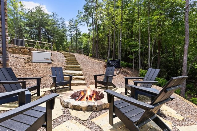 a roof deck with a table and chairs