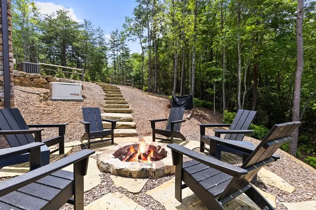 a roof deck with a table and chairs