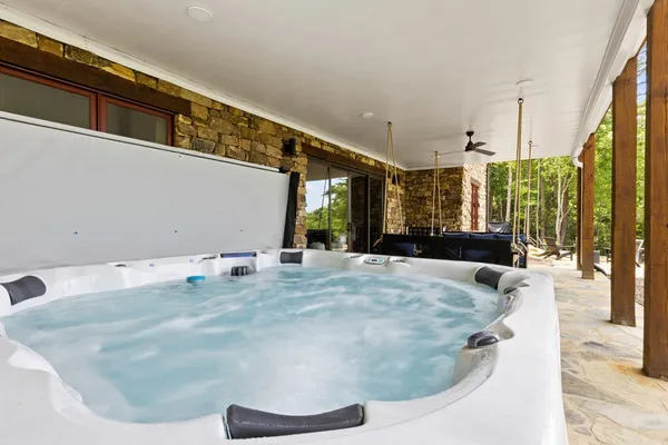 a view of a bench in middle of the green field