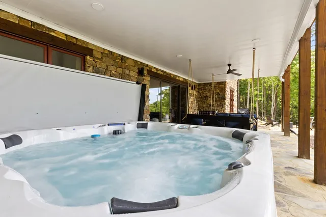 a view of a bench in middle of the green field