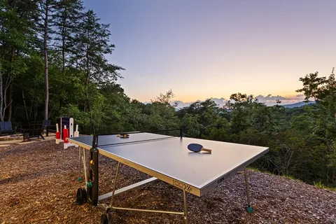a view of a balcony with a table and chairs