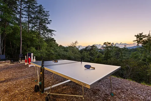 a view of a balcony with a table and chairs