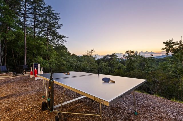 a view of a balcony with a table and chairs