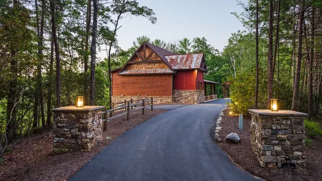 a view of a patio with table and chairs potted plants with wooden floor and fence