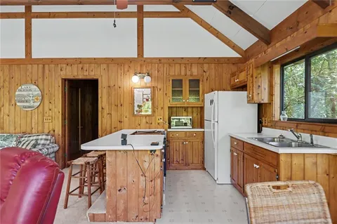 a very nice looking room with a large window and a dining table