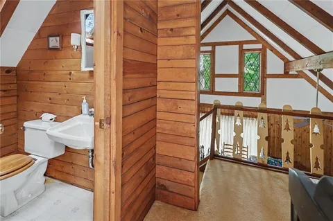 a view of balcony with wooden floor and fence
