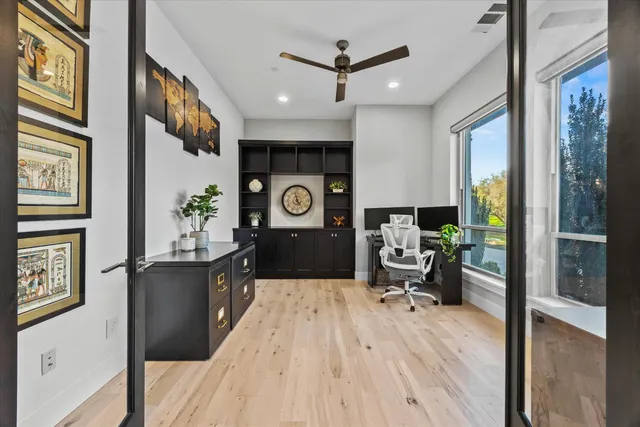 a kitchen with kitchen island granite countertop a sink stainless steel appliances and cabinets