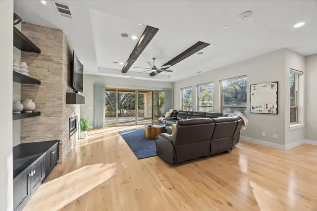 a spacious bedroom with a large bed and a large window