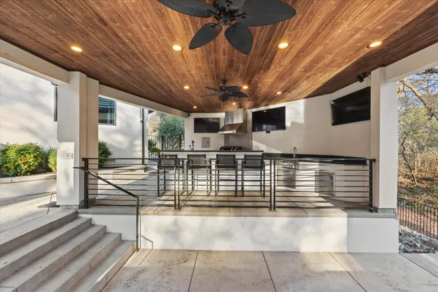 a view of swimming pool with outdoor seating and lake view